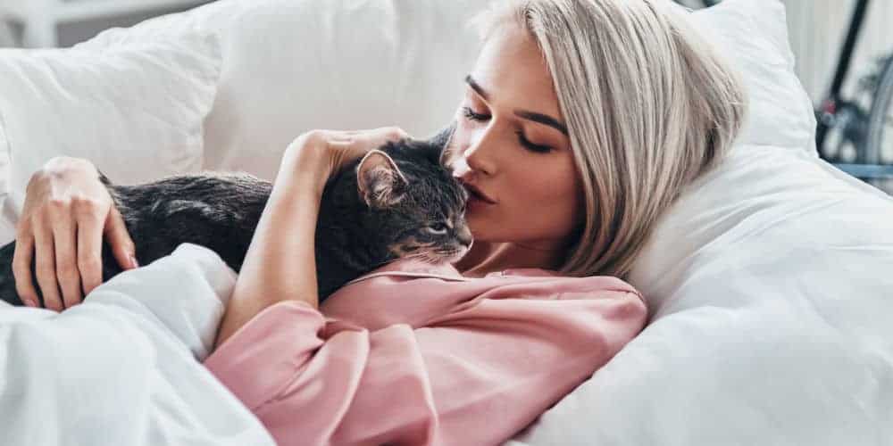Cat Lying on Woman's Chest